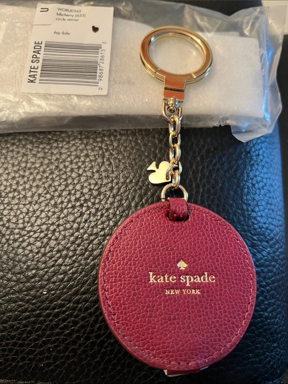 KATE SPADE NWT berry leather circle keyring bag charm with gold hardware